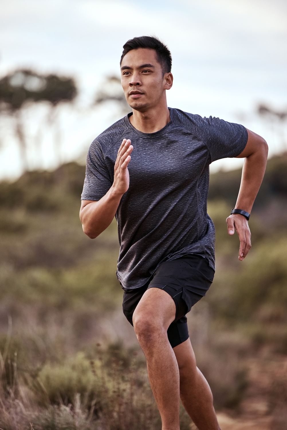 Athletic man running outdoors